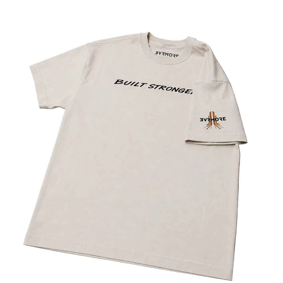 An off-white short-sleeve t-shirt with 'BUILT STRONGE.' printed in black across the chest and a small orange and black graphic on the left sleeve cuff, displayed flat on a gray background.