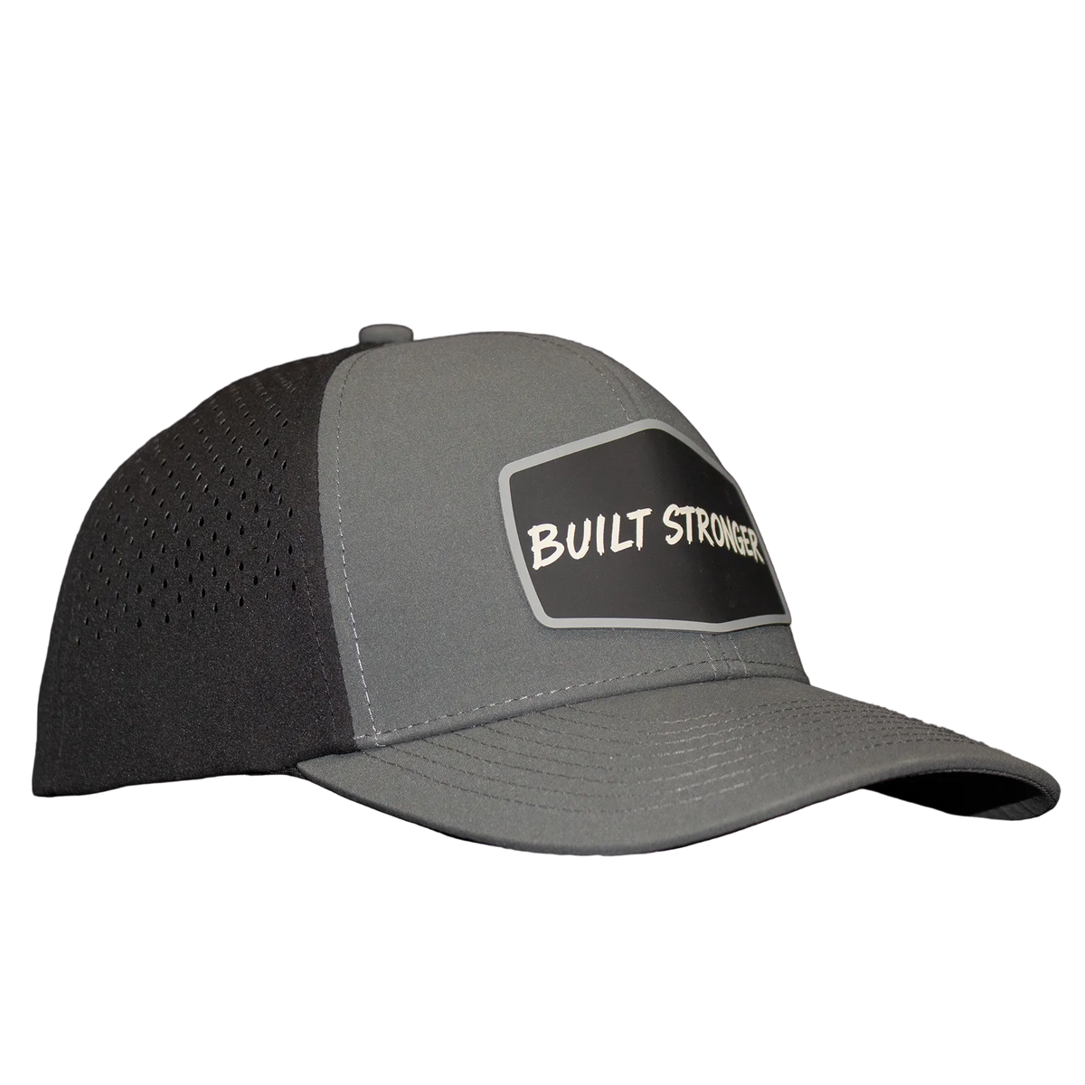 A gray trucker-style cap with perforated back panels and a black front patch reading 'BUILT STRONGER' in white, photographed against a dark gray backdrop.