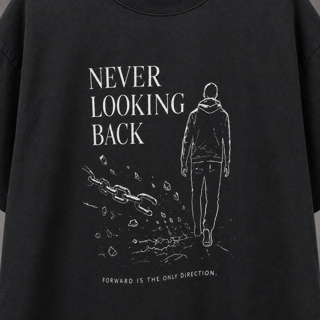 A close-up of a black graphic t-shirt featuring a white line art illustration of a person walking forward, with the text 'NEVER LOOKING BACK' and 'FORWARD IS THE ONLY DIRECTION.'.