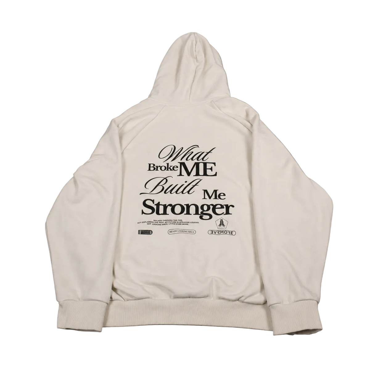 An off-white hooded sweatshirt shown from the back, featuring a black graphic text print that reads 'What Broke ME Built Me Stronger' with smaller text and logos underneath, laid flat on a gray background.