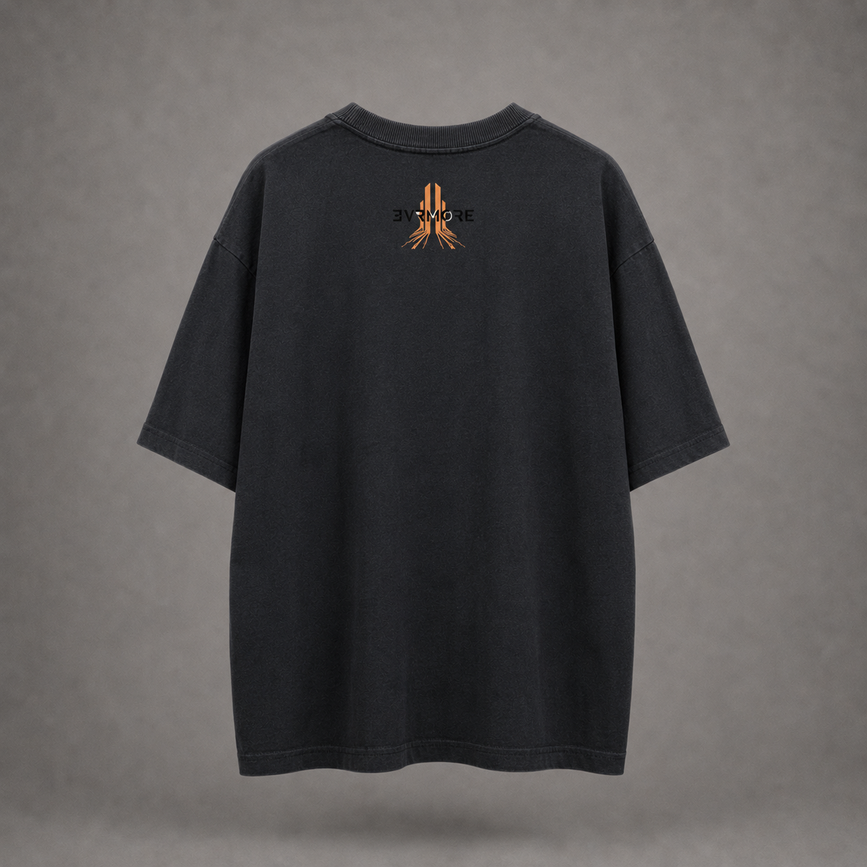 A washed black short-sleeve t-shirt shown from the back, featuring a small orange and black graphic logo centered on the upper back, set against a textured gray background.
