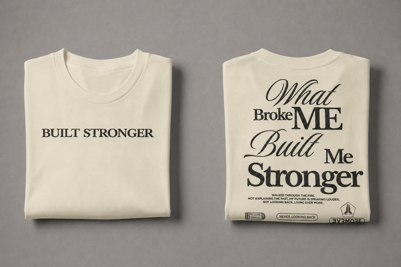Two folded cream-colored t-shirts displayed side-by-side on a neutral gray background. The left shirt features the text 'BUILT STRONGER' in black serif font.