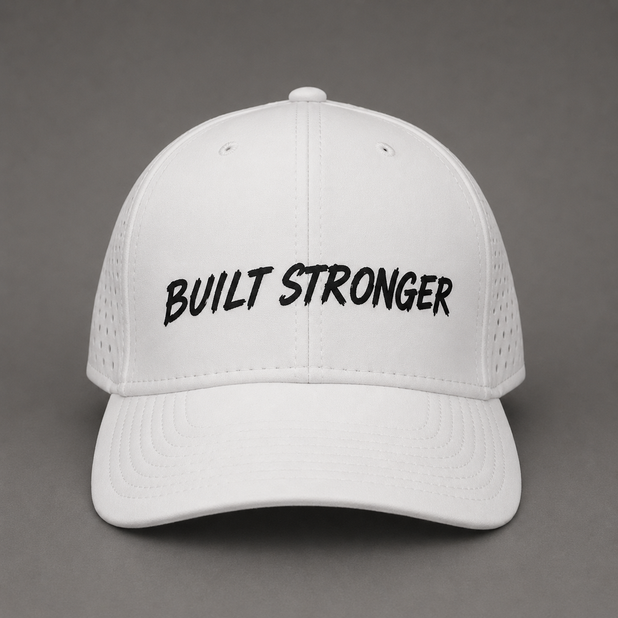 A white baseball cap with 'BUILT STRONGER' embroidered in black script across the front, set against a solid gray background.