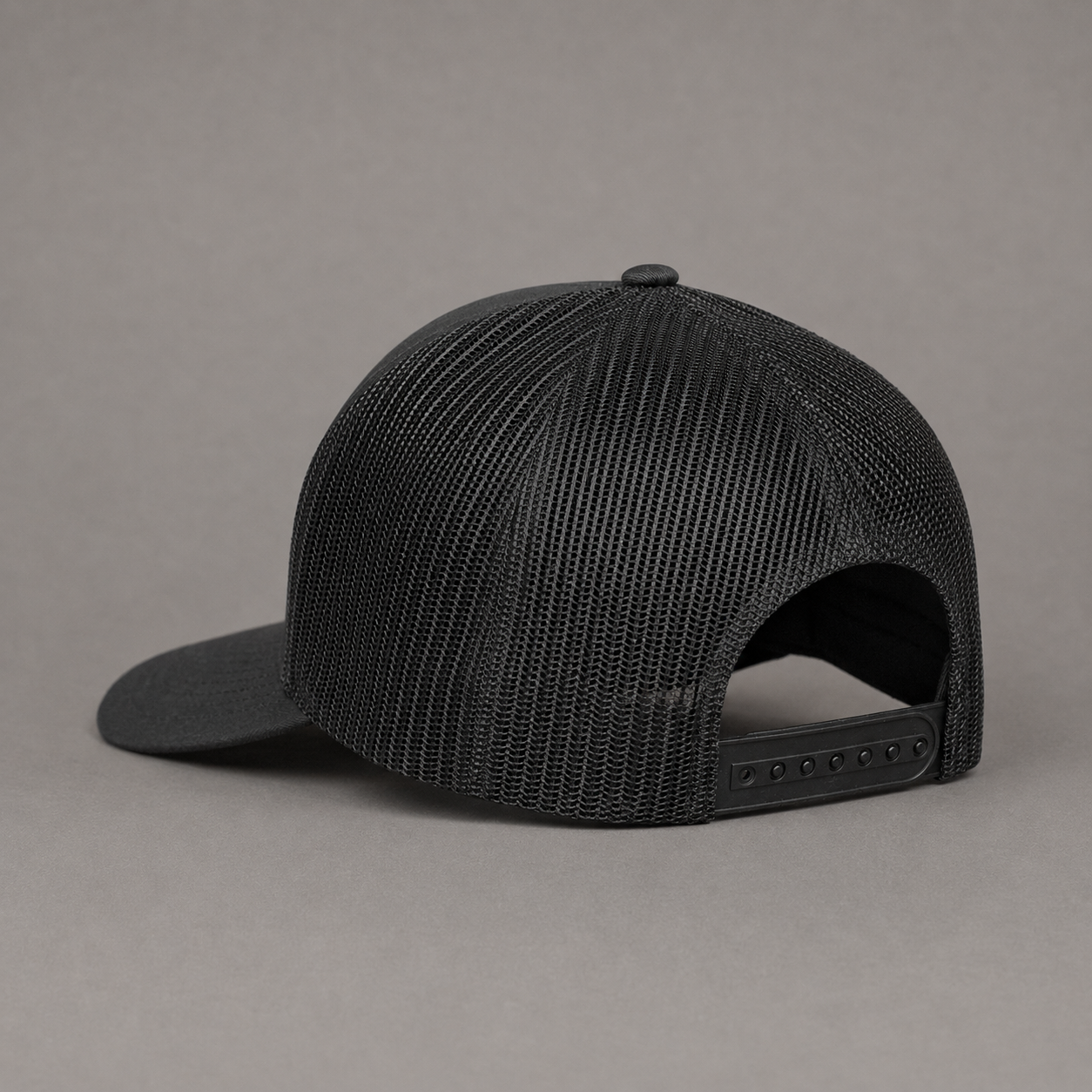 Black hat with a gold button on a white background