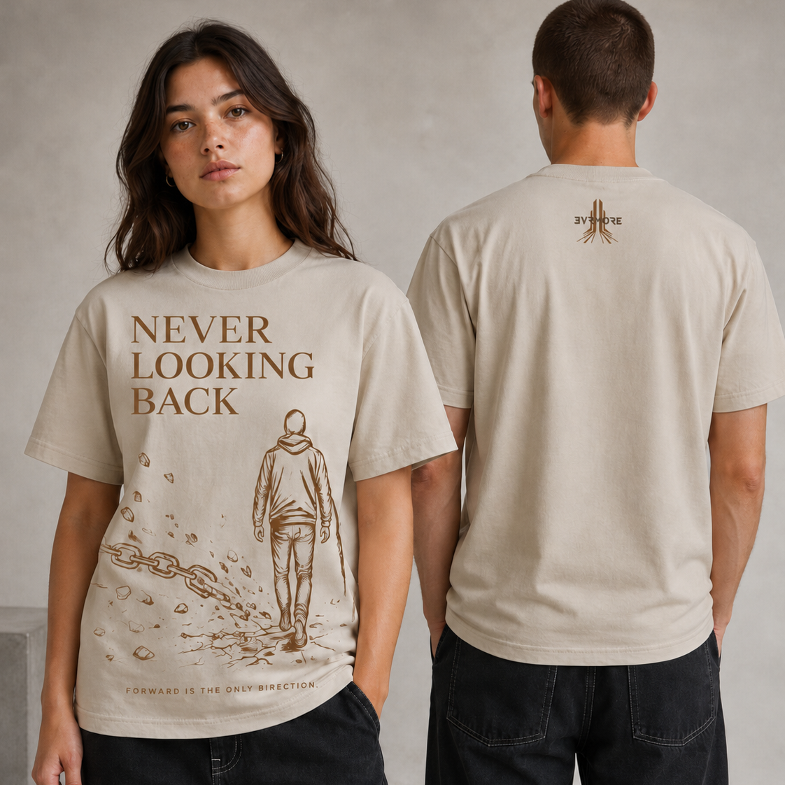 A man and a woman modeling a beige graphic t-shirt. The woman shows the front of the shirt, which features the text 'NEVER LOOKING BACK' and a sketch of a person walking forward.