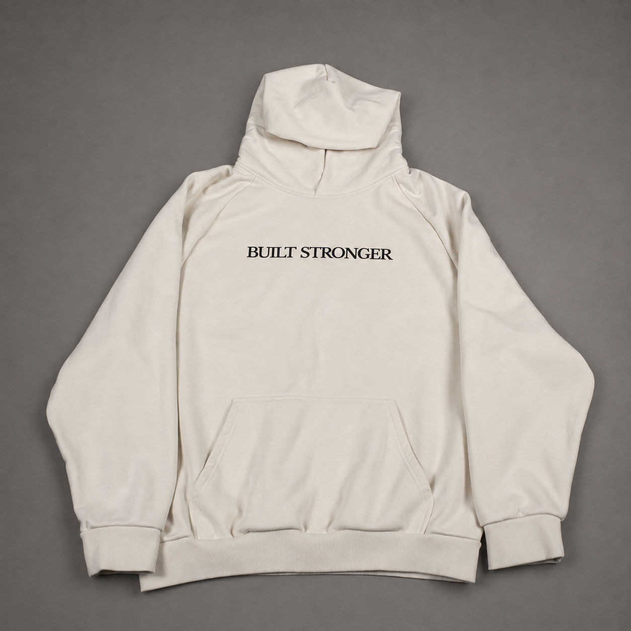 An off-white pullover hoodie with 'BUILT STRONGER' printed in black serif text across the chest, laid flat on a neutral gray background.